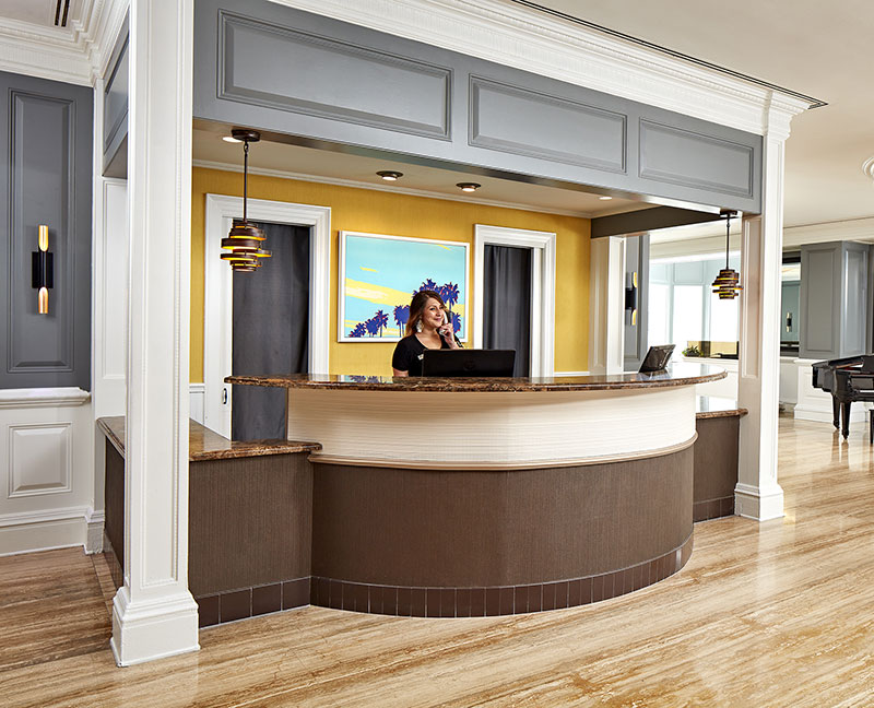 Photo of hotel agent greeting guest